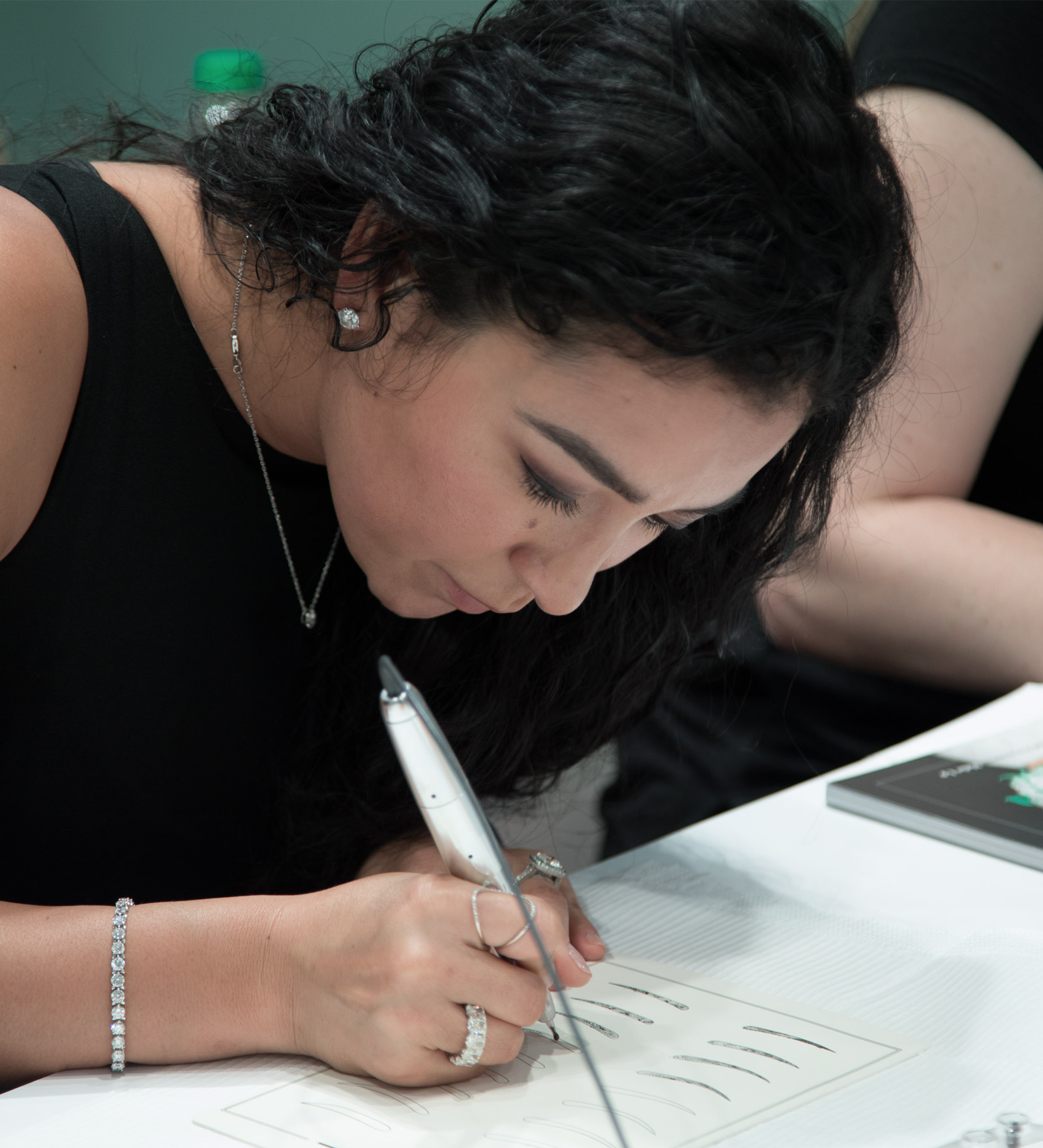 amiea Academy - beginners Woman using an amiea device on latex in amiea academy course