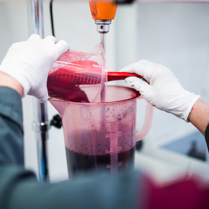 a picture of an employee testing colors in amiea production center