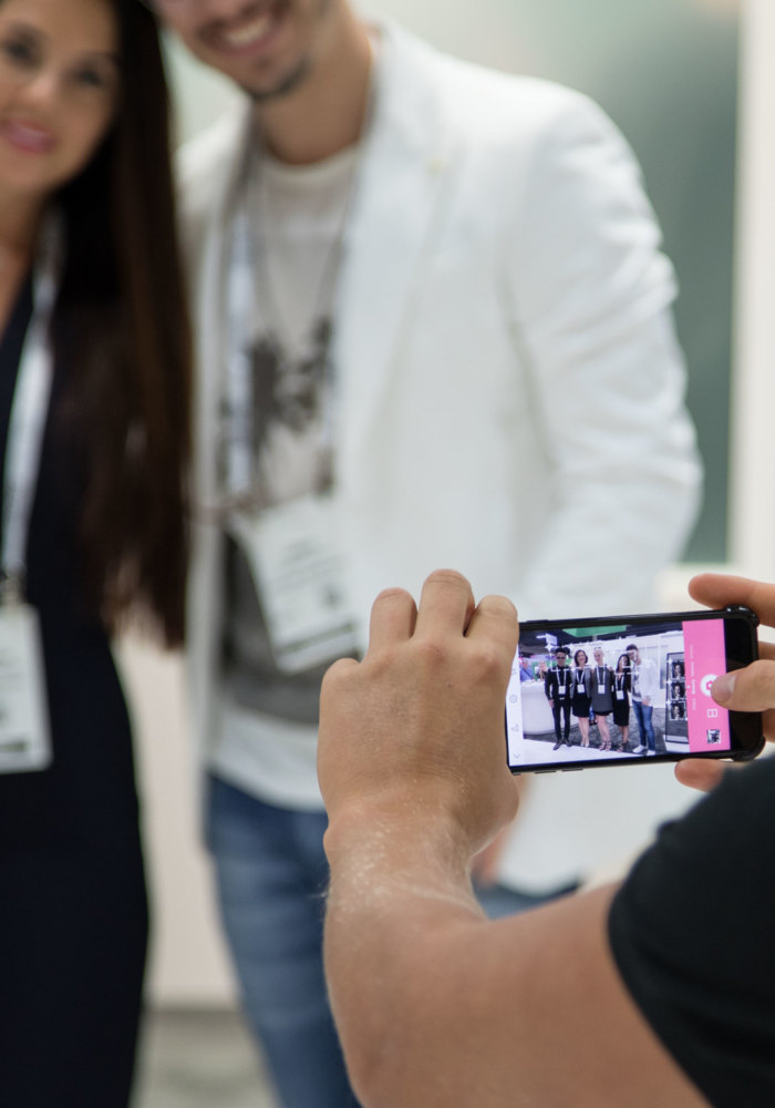 amiea artists taking selfies at an event